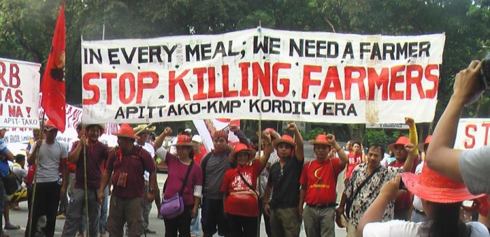 Protest by Apit Tako, member of the CDPC network, following the murder of five farmers in September 2016 © Apit Tako